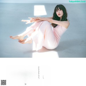 A magazine with a picture of a woman holding a rose.