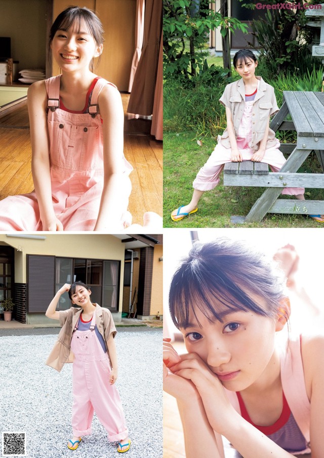 A woman in a pink jumpsuit posing for a picture.